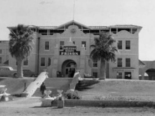 A black and white photo of the front entrance to a building.